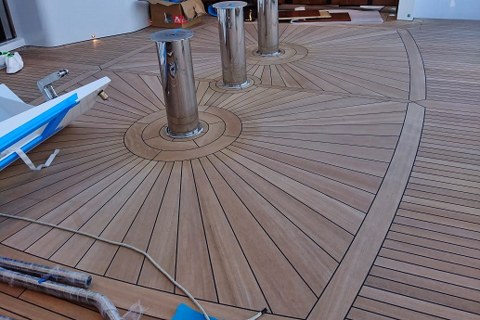 Mosaics in teak deck on super yacht by Duca Solutions
