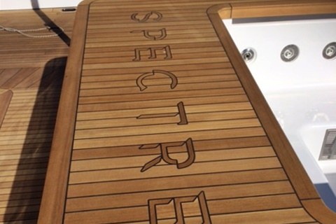 Logo inserted in teak jacuzzi on yacht by Duca Solutions
