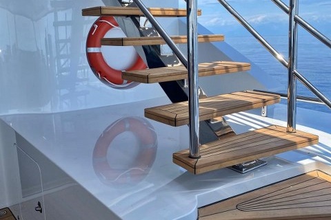 Teak staircase on motor yacht by Duca Solutions